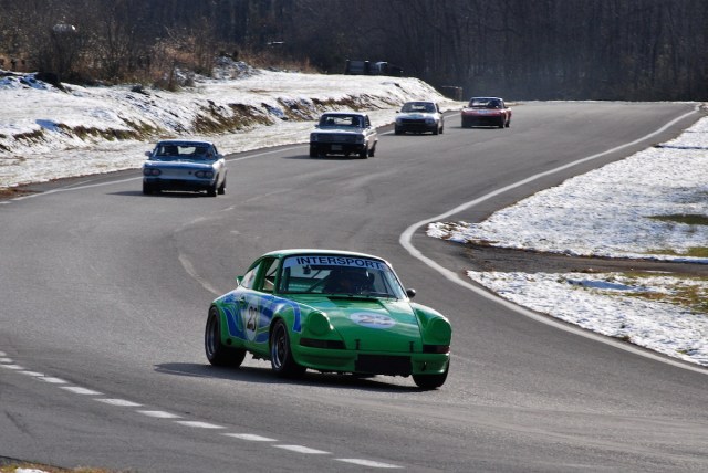 Group 3 - Alan Friedman, 1973 Porsche 911 RSR (#23) leads a pack through turn 3.