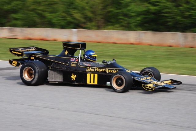 At speed up past the Esses, with the 1974 Lotus 76/1 of Andrew Beaumont (Surry, UK) #11.