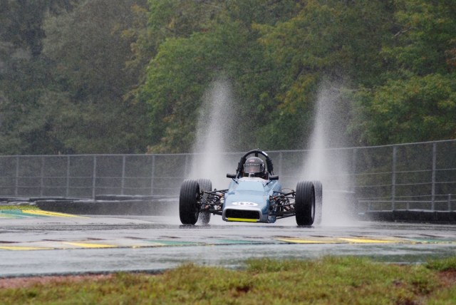 Les Bowers (#32) driving his 1971 Hawke DL2a, showing an impressive rooster tail.