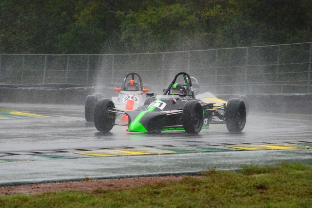 Dave Fairchild (#21) in his 1979 Zink Z-10, leads Scott Fairchild (#20) in a 1978 Zink Z-10.  Dave Allison (#8) can be seen through the mist in his 1969 Alexis Mk15.